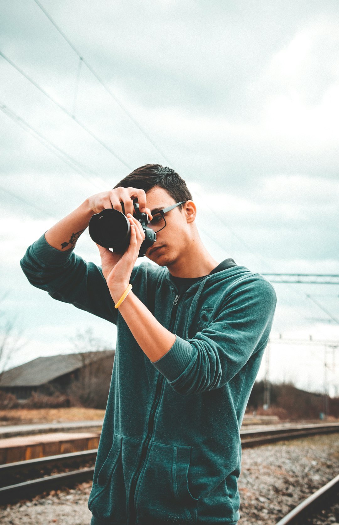 Portrait of a Danish male documentary photographer holding a camera