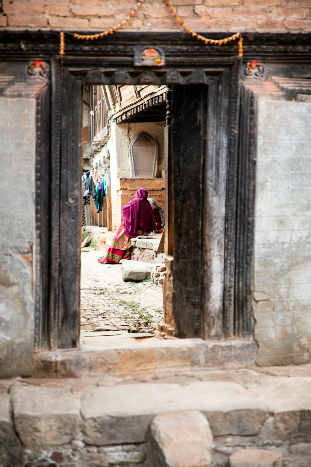 elderly woman in doorway
